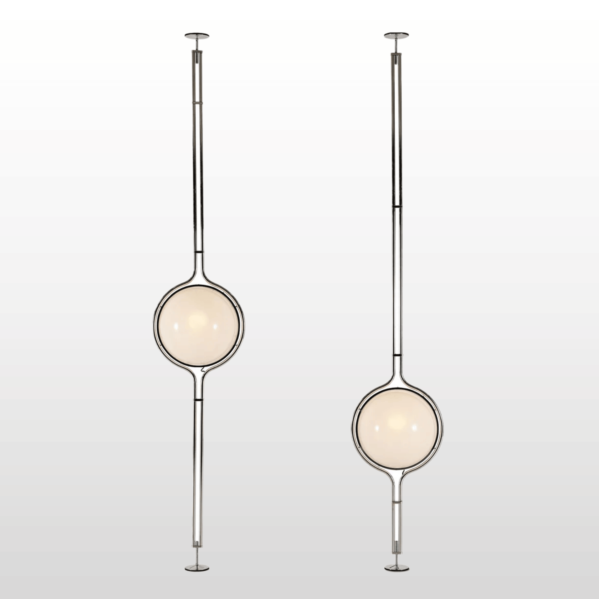 Two modern pendant lights with spherical glass shades on a light gray background