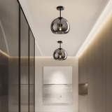 Modern interior with pendant lights and a painting on a wall.
