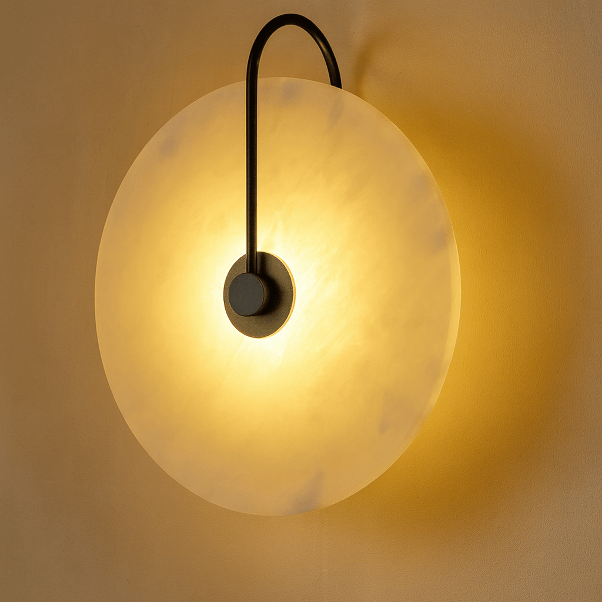 Wall-mounted light fixture with a spherical glass shade on a neutral background