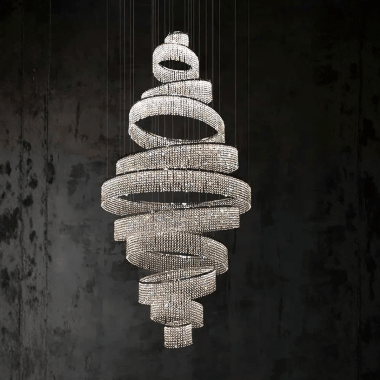 Decorative chandelier with spiral design on a dark background