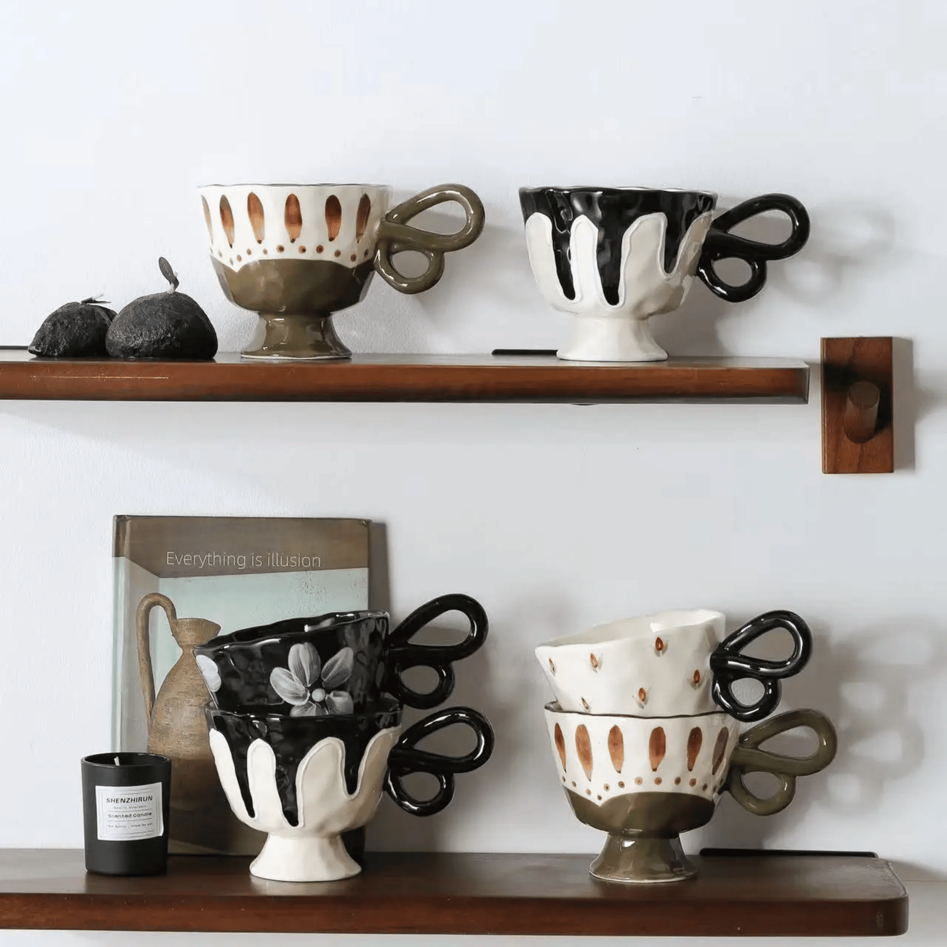 Decorative ceramic cups on wooden shelves against a white wall