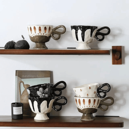 Decorative ceramic cups on wooden shelves against a white wall