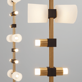 Modern ceiling light fixture with gold and black accents on a gray background