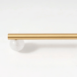 Gold curtain rod on a white background