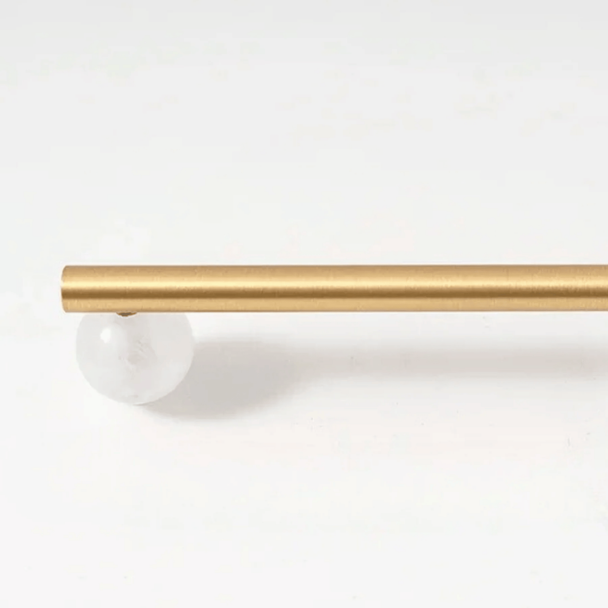 Gold curtain rod on a white background