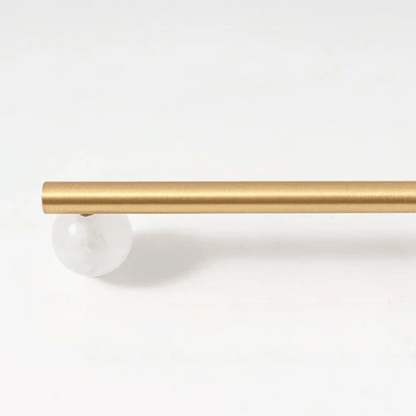 Gold curtain rod on a white background