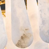 Close-up of marble-textured white shoes with a gold frame in the background