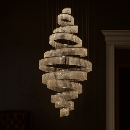 Chandelier with spiral design hanging against a dark background