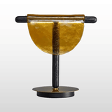 Decorative object with a black and gold design on a white background