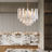 Modern kitchen with a chandelier and marble countertop