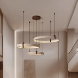 Modern pendant lights hanging from the ceiling in a home setting.