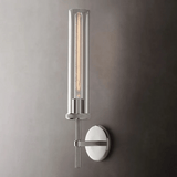 Modern wall sconce with cylindrical design on a gray wall
