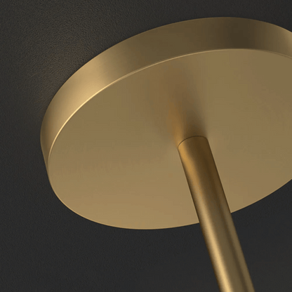 Gold ceiling light fixture against a dark background