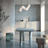 Modern interior with a marble table and geometric pendant light.
