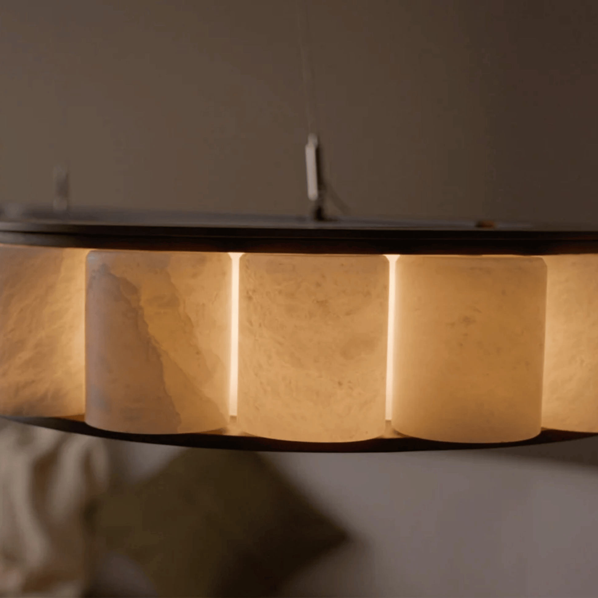 Round wooden table with a dark rim on a neutral background