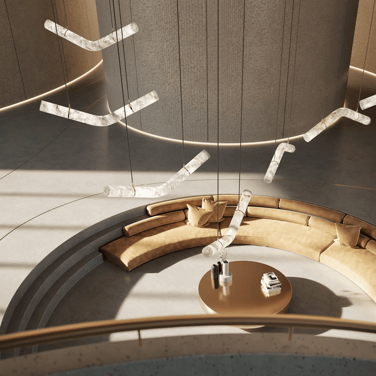 Modern circular seating area with beige cushions and a round table, featuring hanging light fixtures.