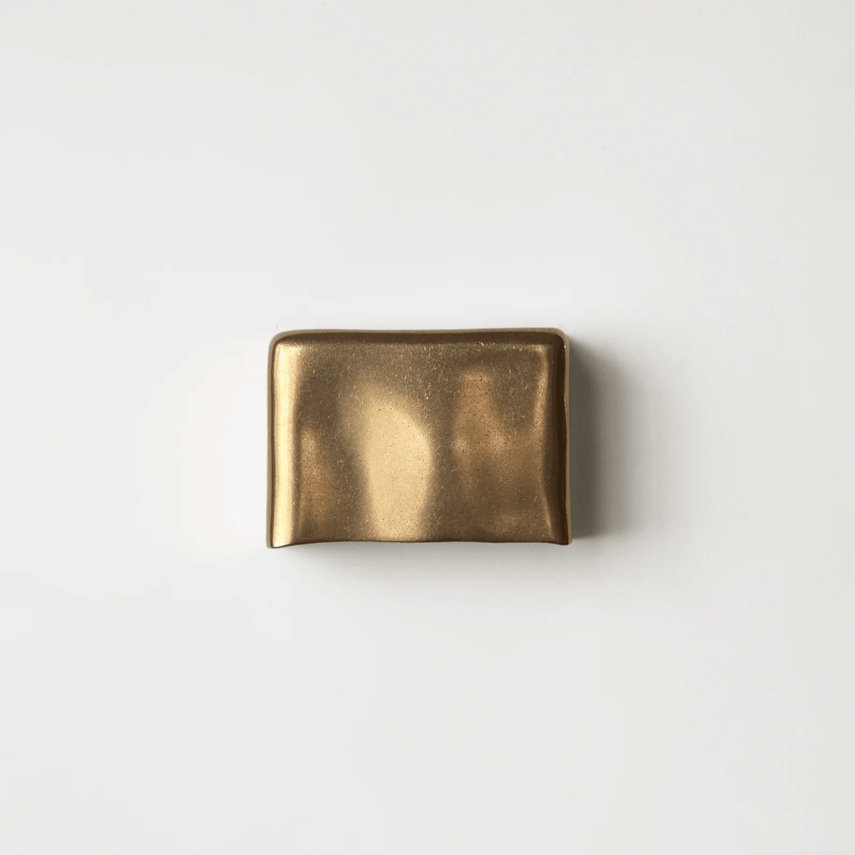 Gold belt buckle on a white background