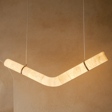 Modern pendant light fixture on a beige wall