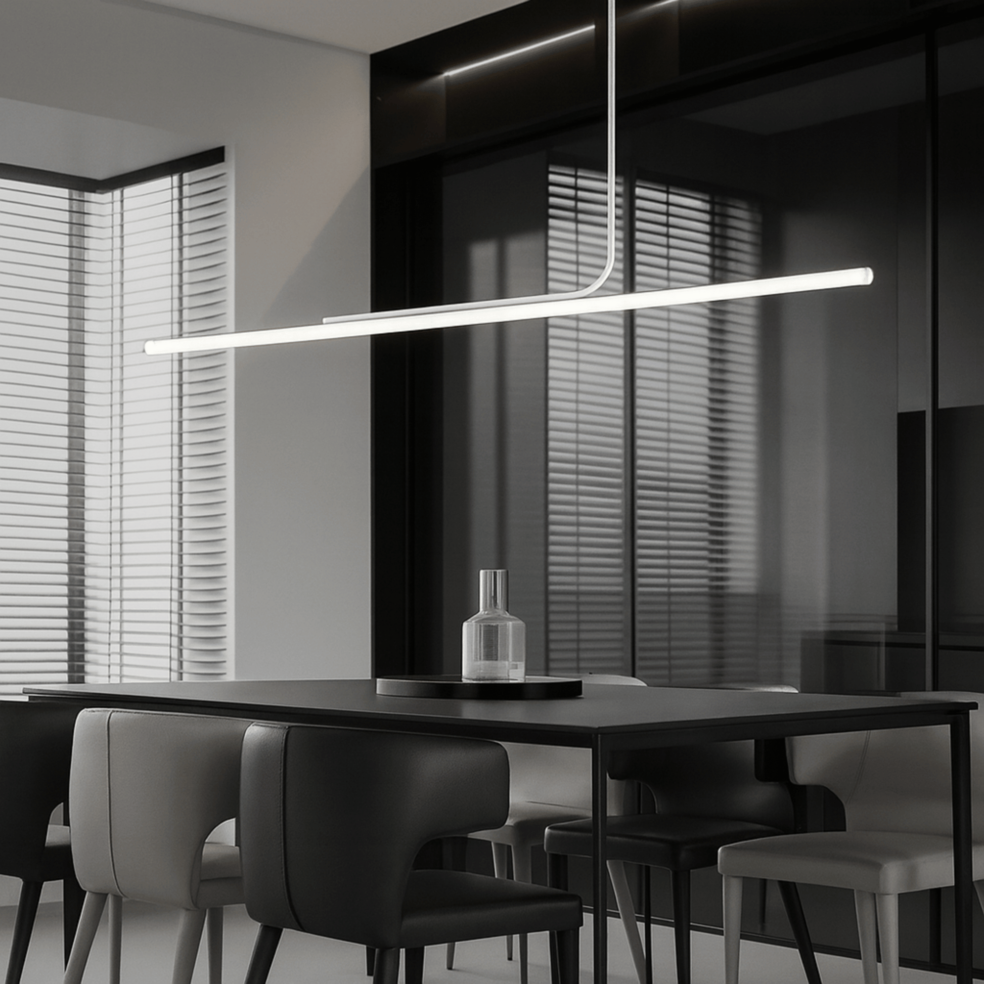 Modern dining room with a long linear pendant light fixture.