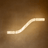 Modern pendant light with a curved design on a brown background