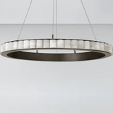 Modern pendant light with circular design on a white background