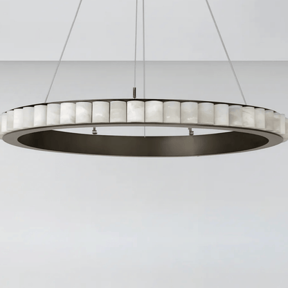 Modern pendant light with circular design on a white background