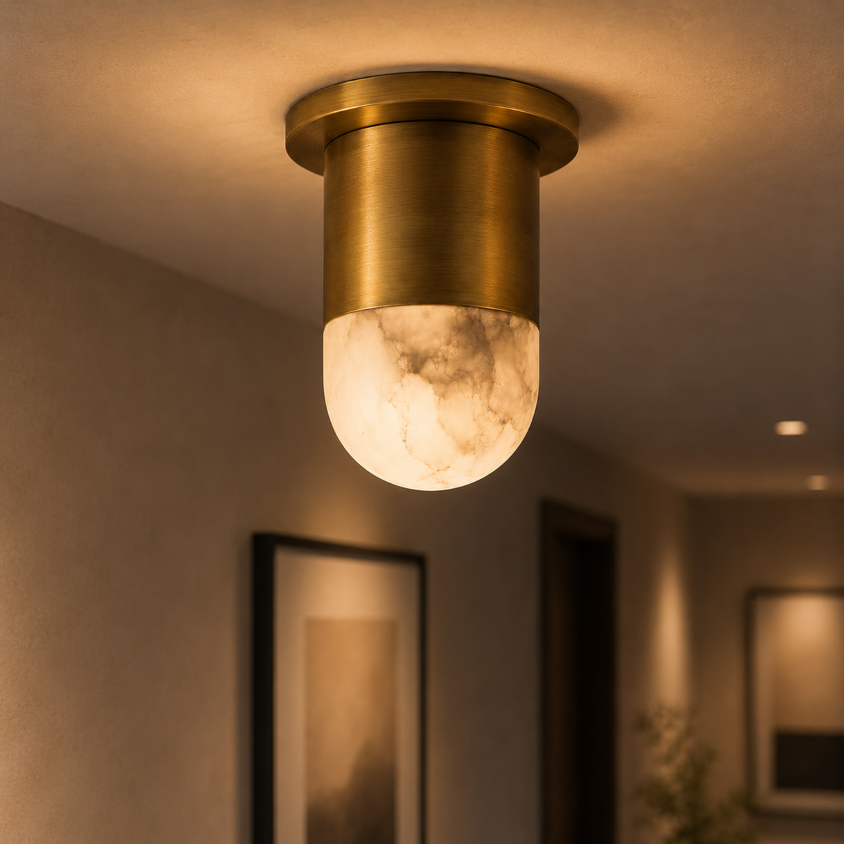Gold ceiling light fixture with a warm glow in a softly blurred room setting