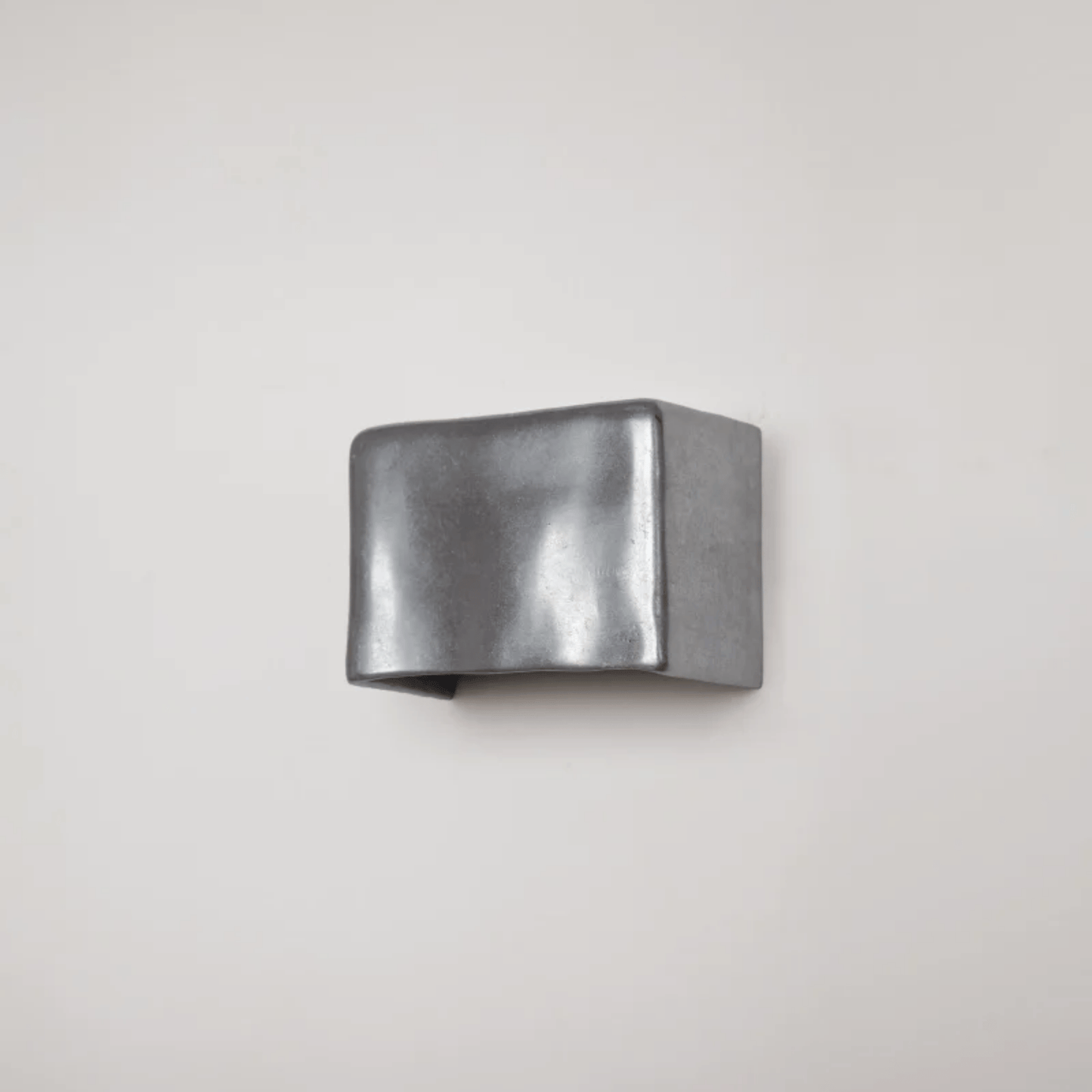 Metallic cuff on a light gray background