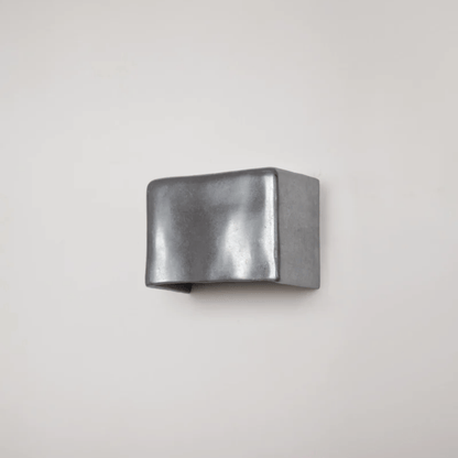 Metallic cuff on a light gray background
