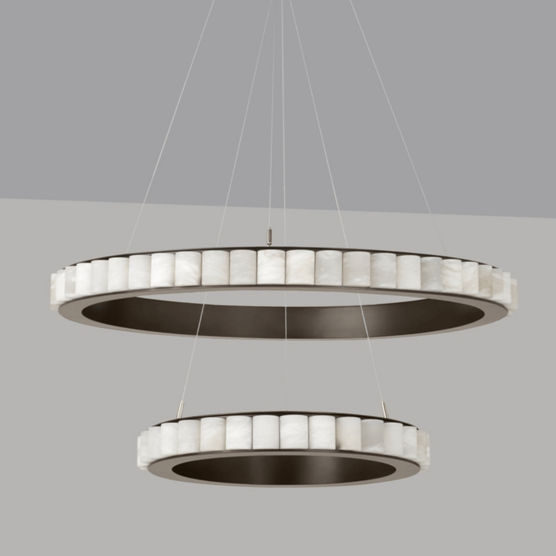 Modern pendant light with circular design on a gray background