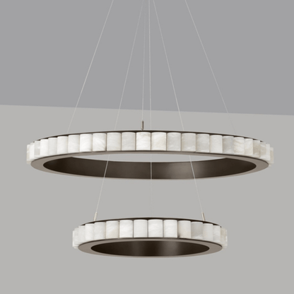 Modern pendant light with circular design on a gray background