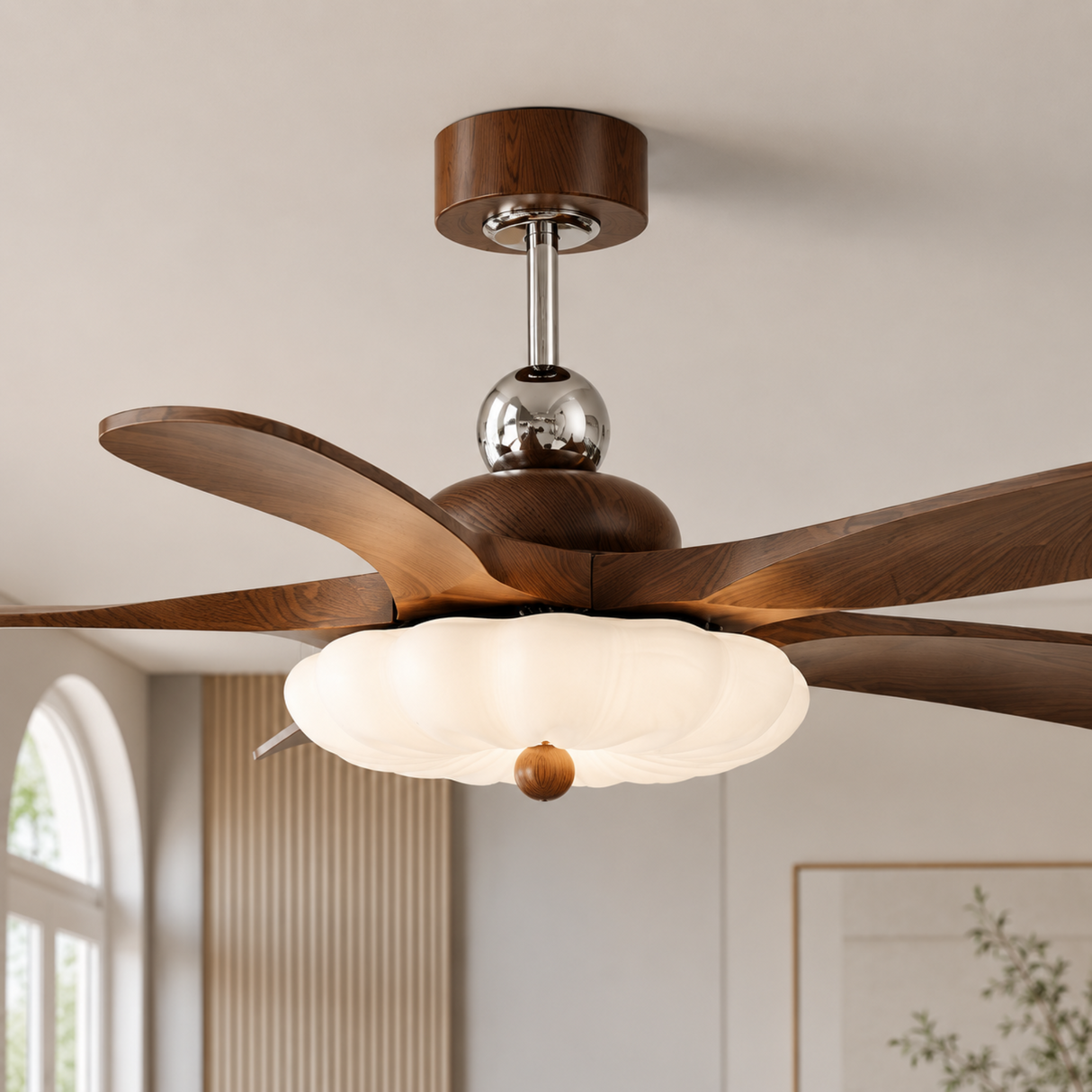 Wooden ceiling fan with light fixture in a room with a window and wall art.