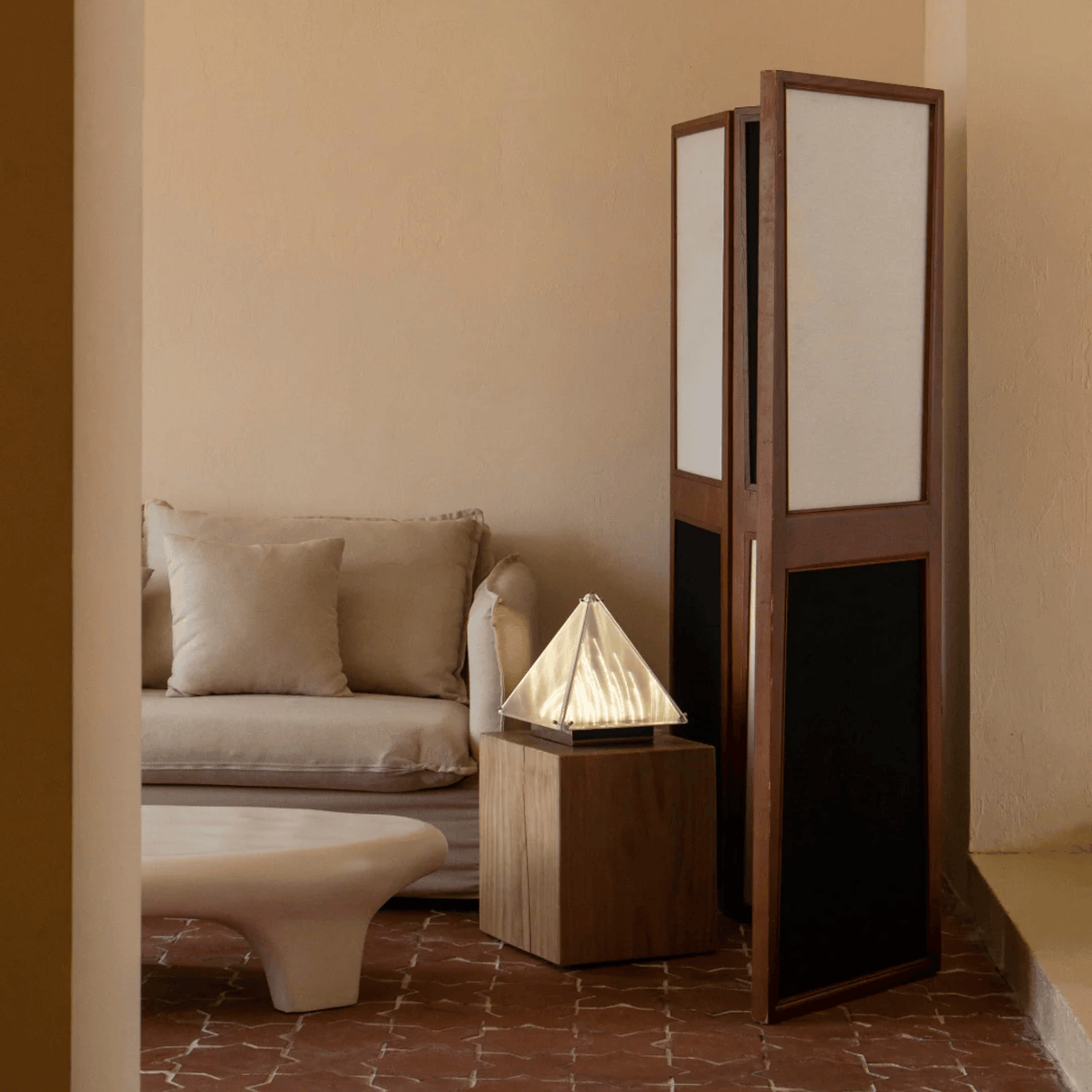 Room divider with geometric design in a living room setting