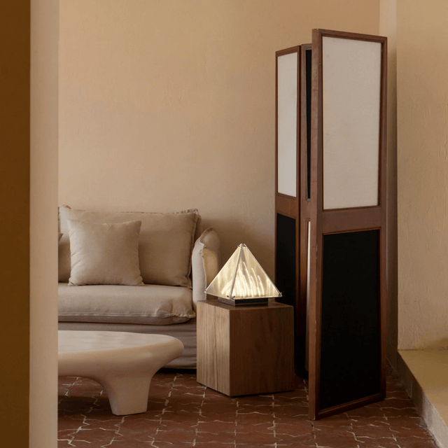 Room divider with geometric design in a living room setting