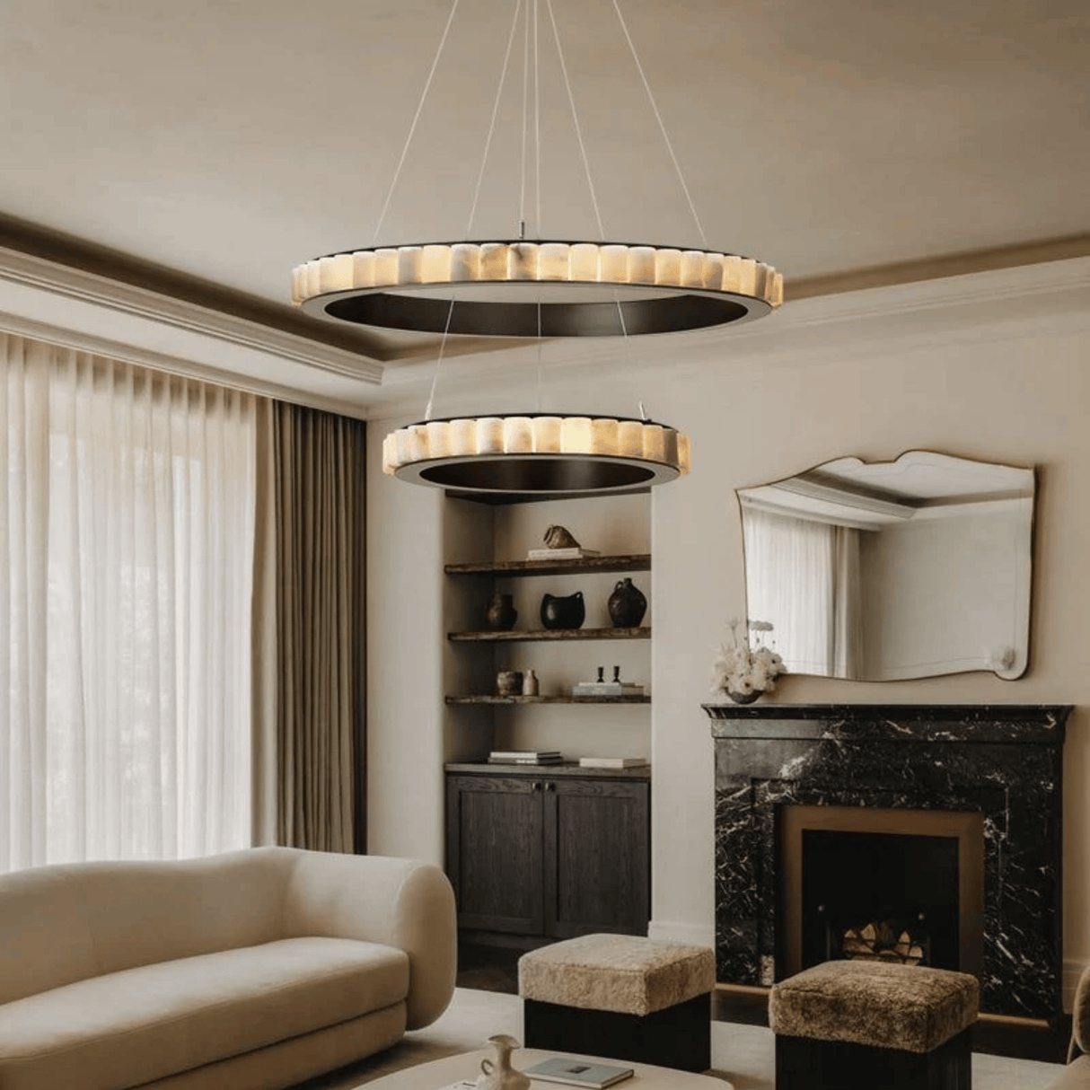 Modern living room with a chandelier, sofa, and fireplace.