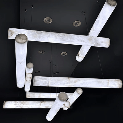 Modern ceiling light fixture with marble-like finish on a black background