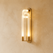 Modern wall-mounted light fixture on a beige wall