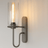 Eterna ShadowGlass Wall Sconce styled in a bedroom — nordic interior by Baskoraa