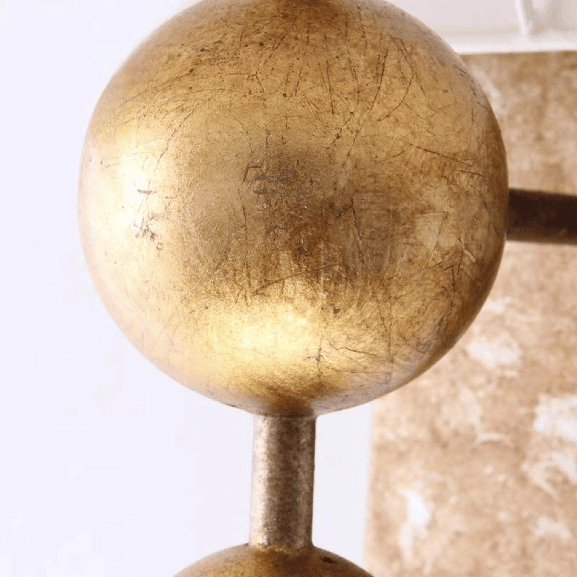 Close-up of a gold spherical object on a white background