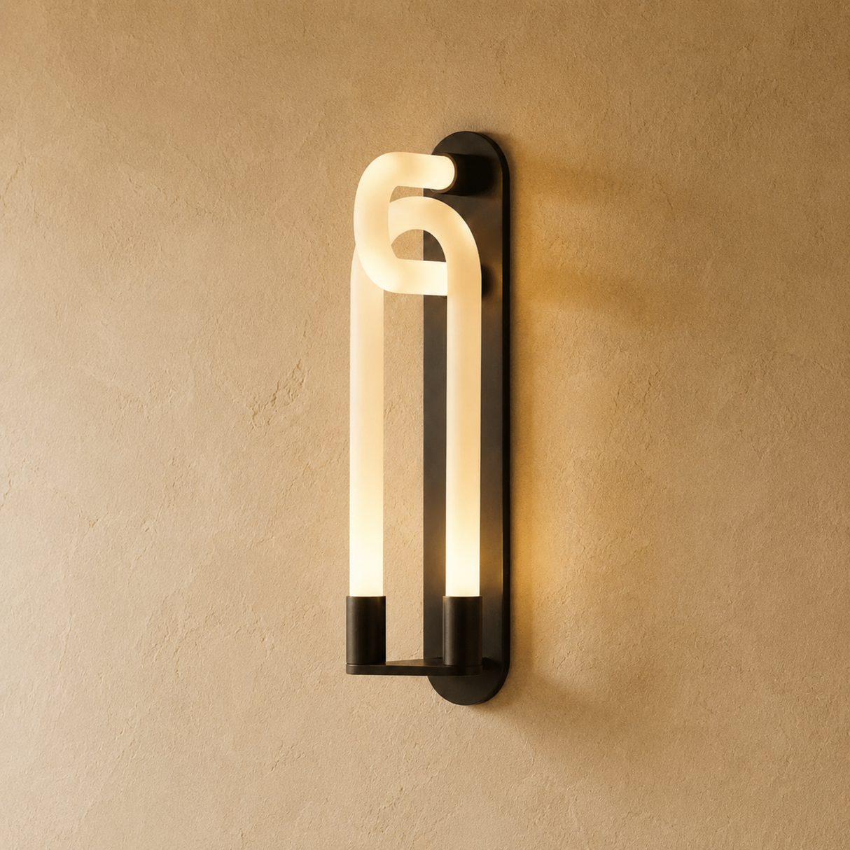 Modern wall-mounted light fixture on a beige wall