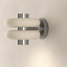 Wall-mounted fixture with marble-like handles on a beige background