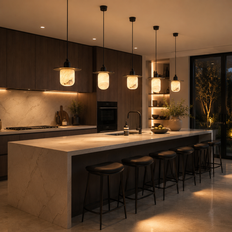 Modern kitchen with a island and bar stools, dimly lit.