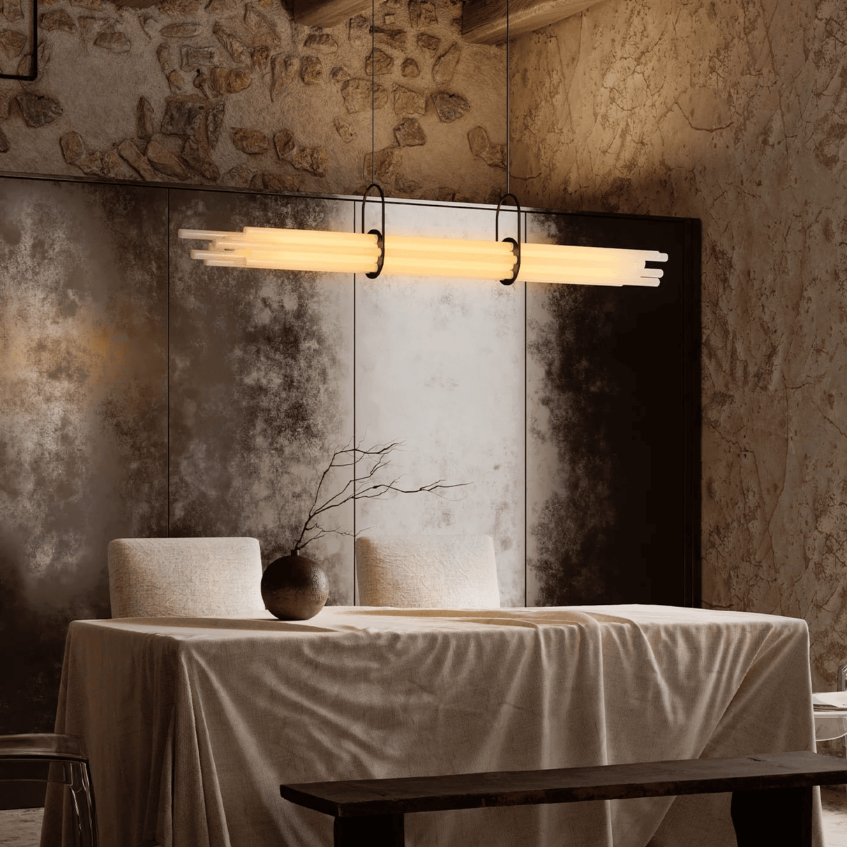 Dining area with a table, chairs, and a modern pendant light in a rustic setting.