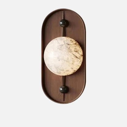 Minimalist wooden wall sconce with round marble-style light and black accent knobs.