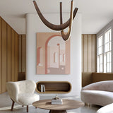 A modern interior featuring a stylish pendant light with wooden curved arms and soft lighting hanging above a dining table.
