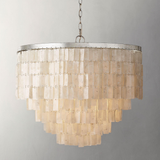 Chandelier with layered glass shades on a gray background