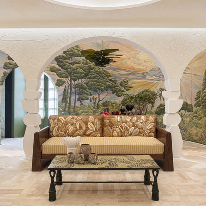 Decorative sofa and coffee table in a room with mural wall art