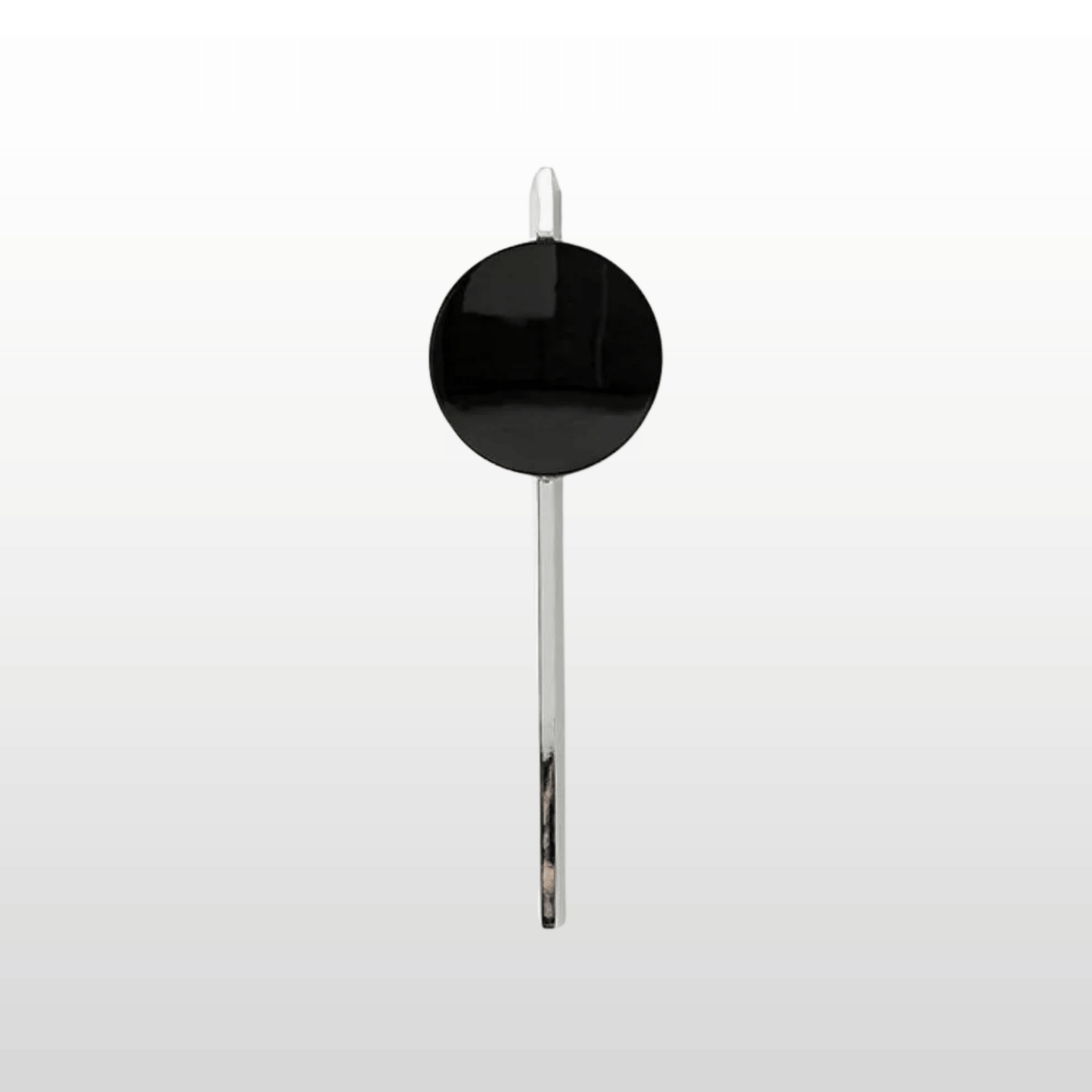 Black spoon with a round handle on a white background