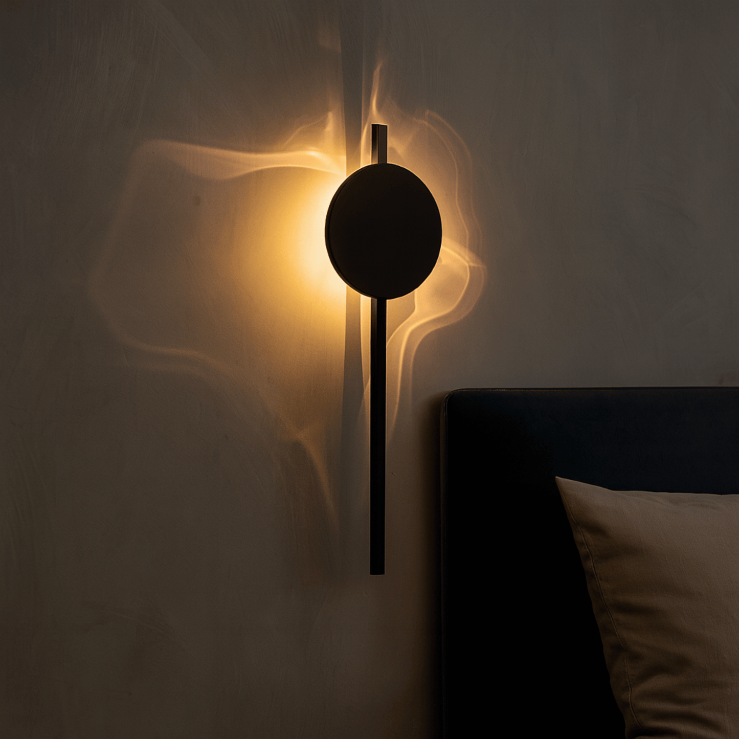 Modern wall lamp with a circular design on a neutral wall.