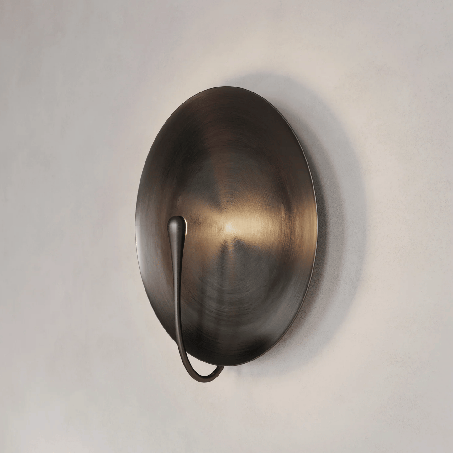 Bronze wall sconce on a light gray background